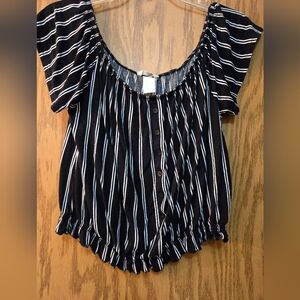 Cute off the shoulder black and white stripped blouse with elastic around waist.